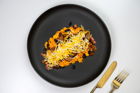 HealthyHolic Steak Burrito Bowl prepared meal with grilled steak, Mexican rice, melted cheese, and pico de gallo