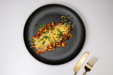 HealthyHolic Turkey Chili Sweet Potato prepared meal with beans, cheddar cheese, and roasted sweet potatoes